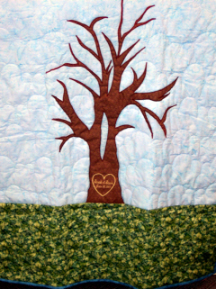 This quilt is available as a pattern only. After quilter appliques the tree to the background, leaves can be added which have been signed by family members at a reunion, wedding, birthday or any occasion. Pattern only $7.00 